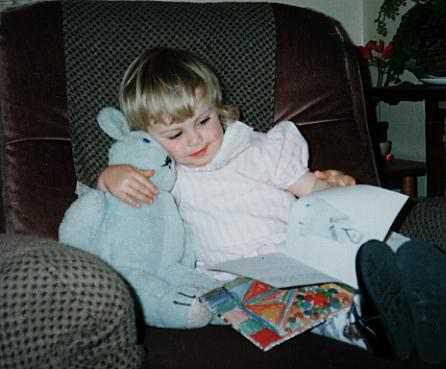 Melissa cuddling a bear.